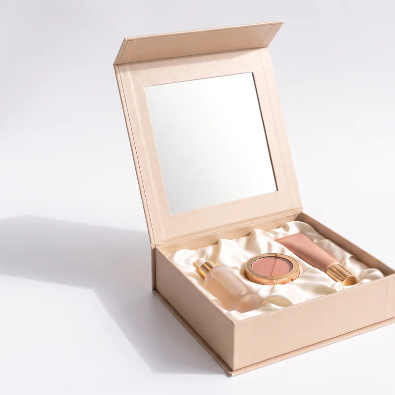 Open champagne beauty box with a mirror in the lid