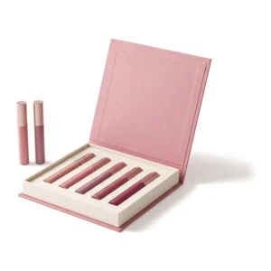 Dusty rose lip gloss gift box open with five tubes in an ivory insert