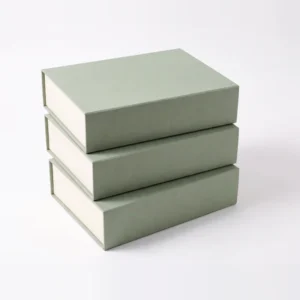 Three sage green presentation boxes stacked